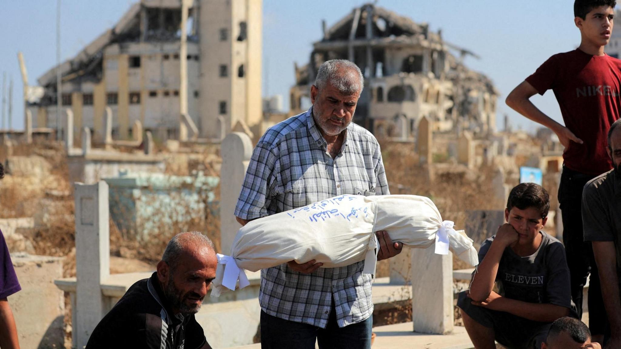 Israeli Airstrikes Claim 12 Lives in Gaza, Including Entire Family