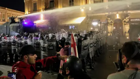 Chaotic Clash in Tbilisi: Protesters Attempt to Breach Presidential Palace