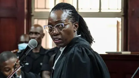 Kenyan former justice minister barred from Uganda amid treason case drama