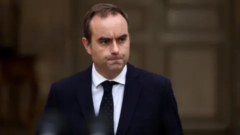 French Prime Minister Overcomes Budget Hurdle Amid Political Divide